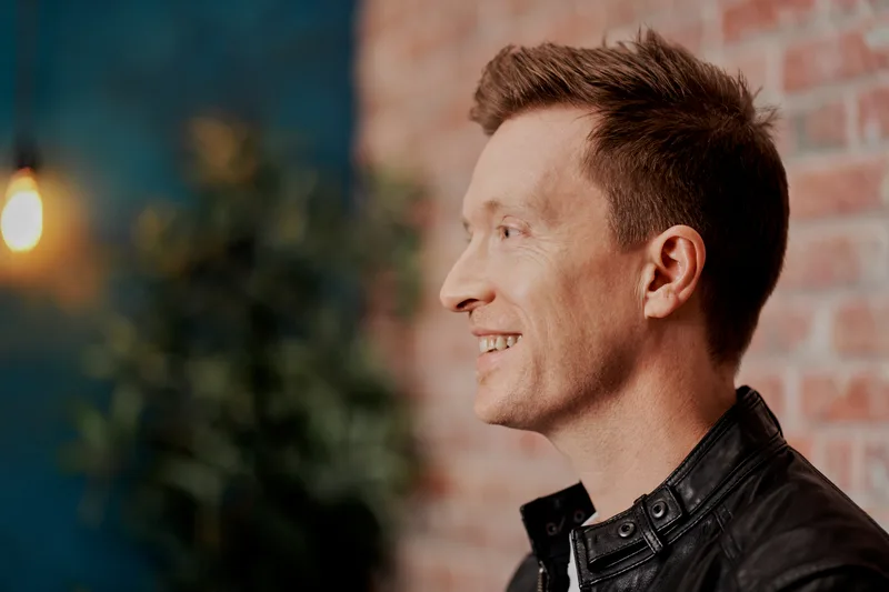 Olly Richards, business coach for online education entrepreneurs, working at his desk